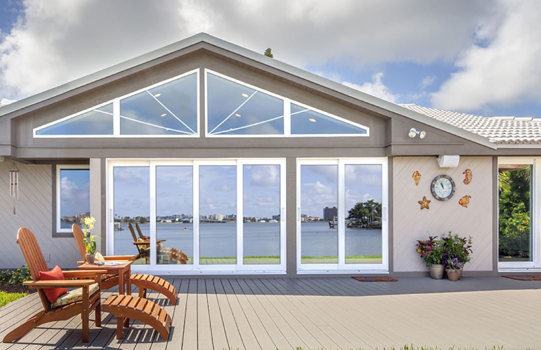 PGT WinGuard vinyl impact windows and sliding glass doors on a waterfront Tampa Bay home
